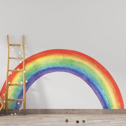 Classic colorful watercolor rainbow wall decal behind a wooden ladder